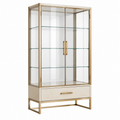 Vitrine 90 x 40 x 180 cm aus Glas und Metall in Gold mit Schublade